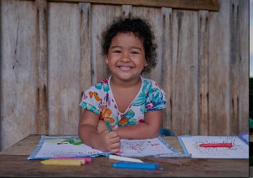 Child from a farming family enjoying an educational activity